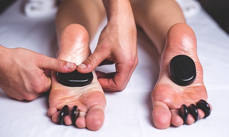 Close-up of a foot being massaged with expert techniques to relieve tension.