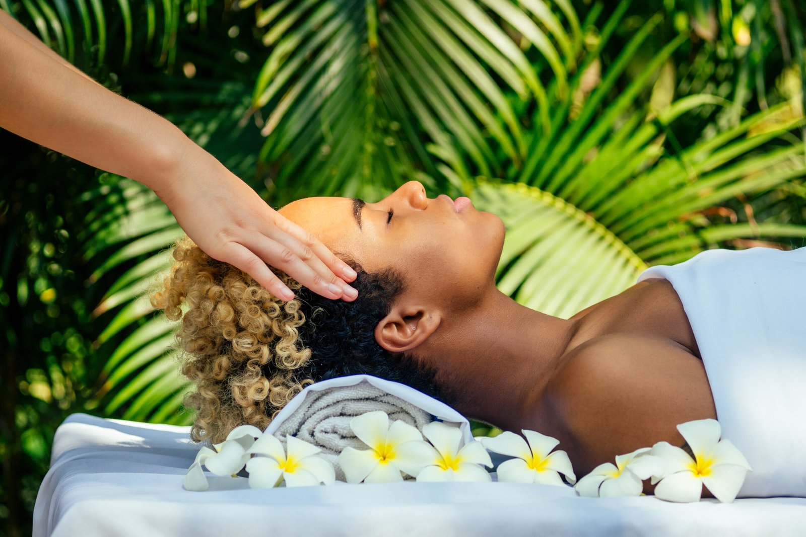 Peaceful spa environment offering therapeutic head massage and relaxation.